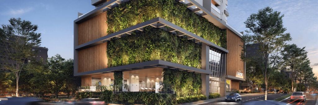 Empreendimento moderno com fachada verde e arquitetura contemporânea, destacando localização para morar em frente ao Colégio Marista Chapecó.